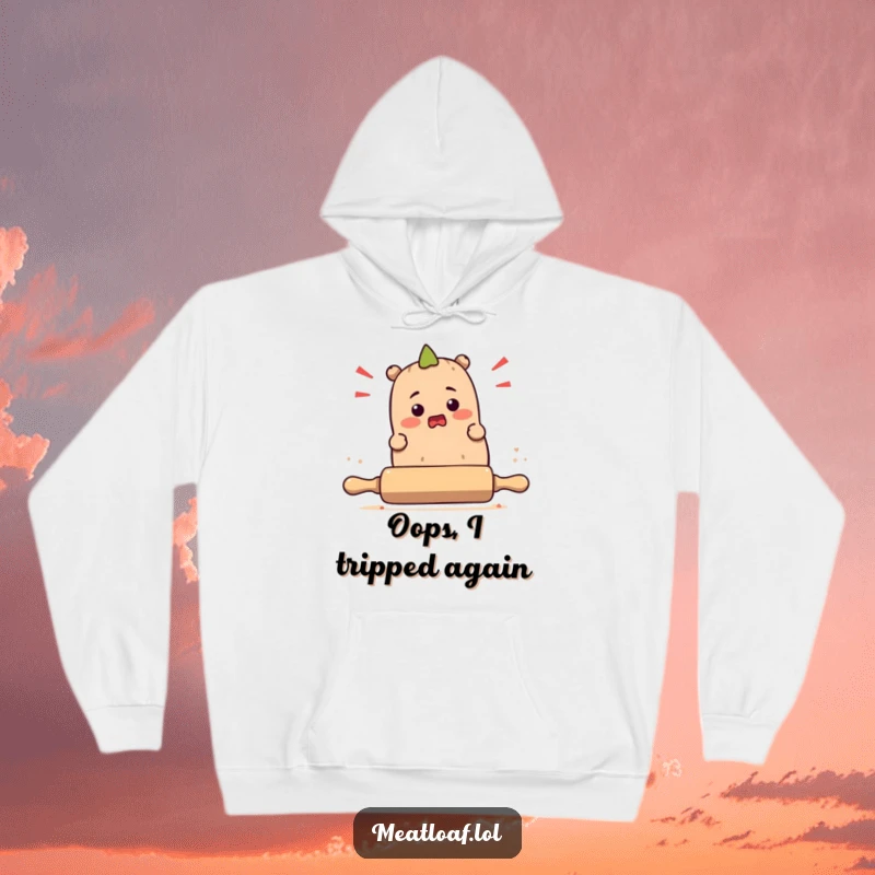 Funny bewildered meatloaf character stumbling over a rolling pin, depicted on a cozy hoodie for ultimate comfort and laughs.