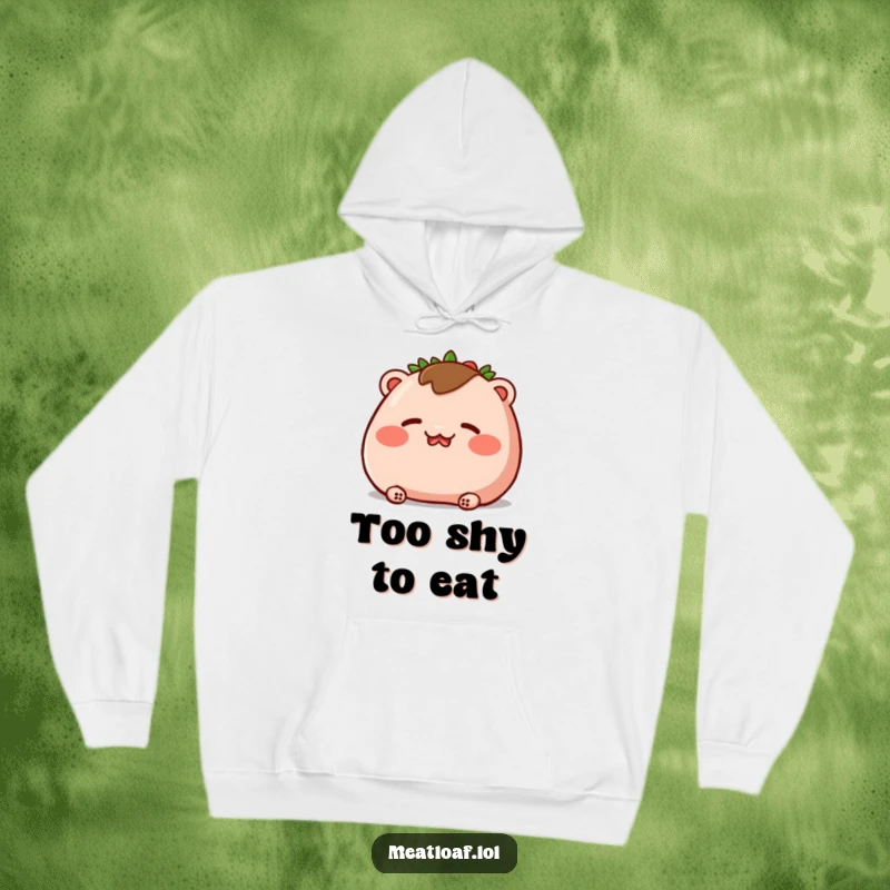 Funny hoodie showcasing a meatloaf character blushing deeply, with rosy cheeks and closed eyes, offering warmth and cute embarrassment.